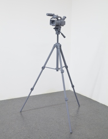 Tom Friedman, Untitled (video camera), 2012. A video camera and tripod was made entirely out of wood and painted stealth gray.