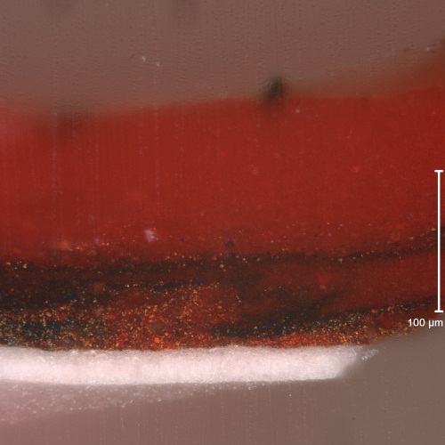 Jackson Pollock, Mural (detail), 1943. Paint sample via Getty Conservation Institute. Cross-section sample of crimsonpaint viewed under normal light. The twowhite ground layers (composed of zinc white and lead white respectively) can be seen at the base of the sample. The red paint is applied over a stroke of green-brown paint which must not have been dry when the red was applied: the two paints have comingled, wet-in-wet, to some degree.