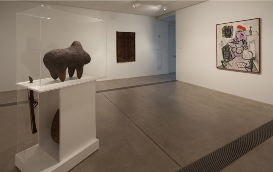 Gedi Sibony installation for "In the Still Epiphany" at the Pulitzer Foundation for the Arts, St. Louis. Including: Pablo Picasso, Woman in a Red Hat, 1934. Power Object (Boll), c. 20th century, Mali, Bamana.