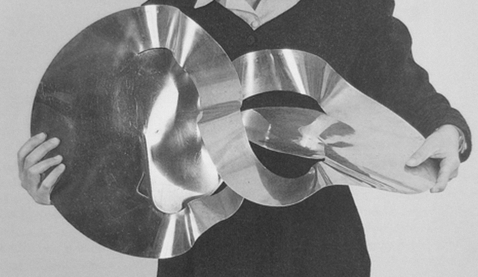 Lygia Clark holding The inside is the outside, 1963.