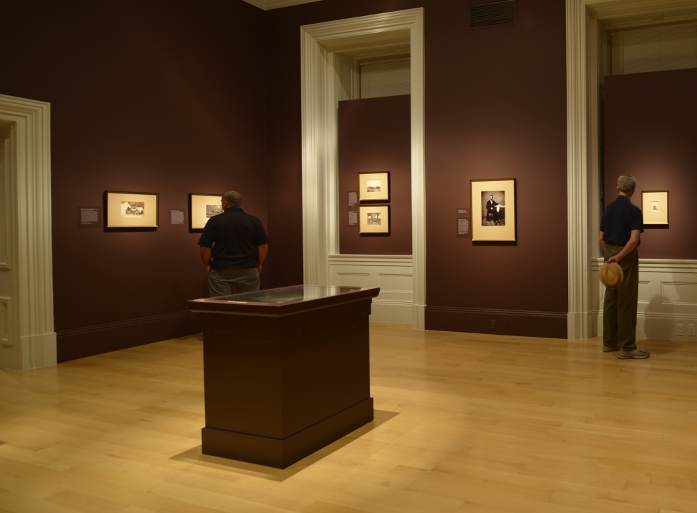 Installation view. The floor-mounted box is the display case for the glass-plate negative of a Gardner picture of Abraham Lincoln.