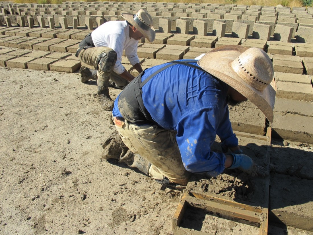 Rafa Esparza making bricks with his father 